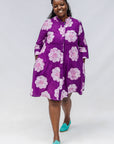 Model wearing purple and white floral print dress.