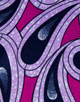 Close up display of purple and pink geometric print dress, fabric.