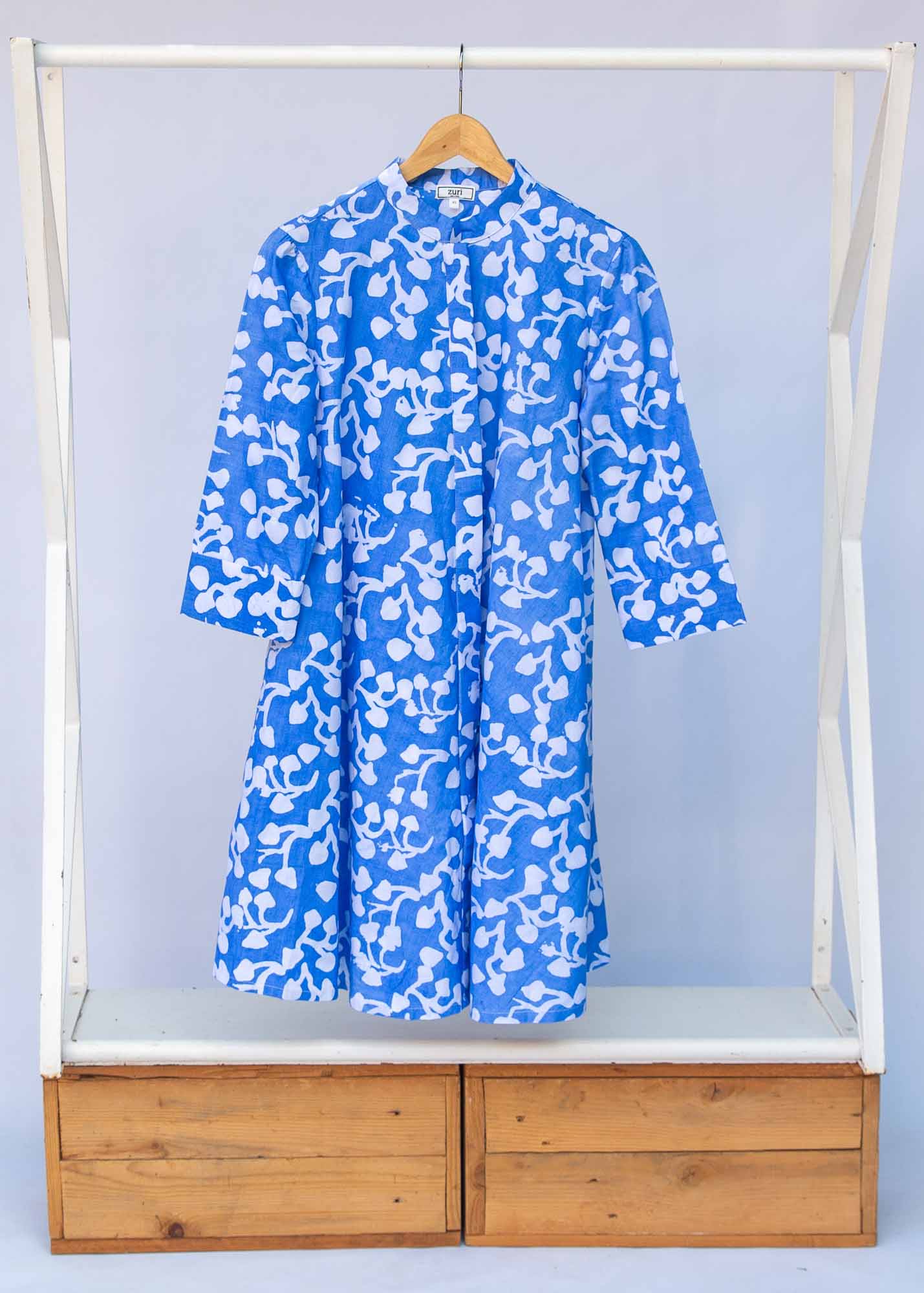Display of blue and white leaf print dress