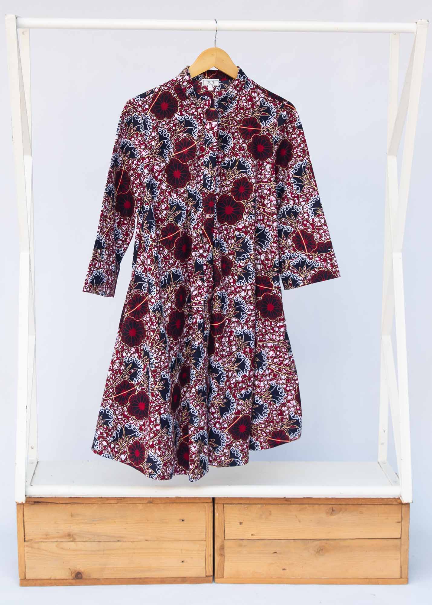 Display of burgundy, white and navy blue floral print dress
