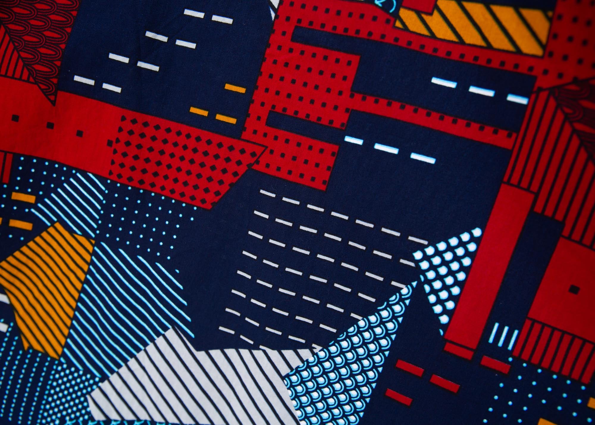 Close up display of multi-colored geometric print dress