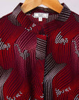 Display of merlot red, brown, red , coral and white abstract line print dress