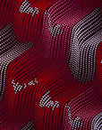 Close up display of merlot red, brown, red , coral and white abstract line print dress