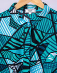Display of turquoise geometric print dress 