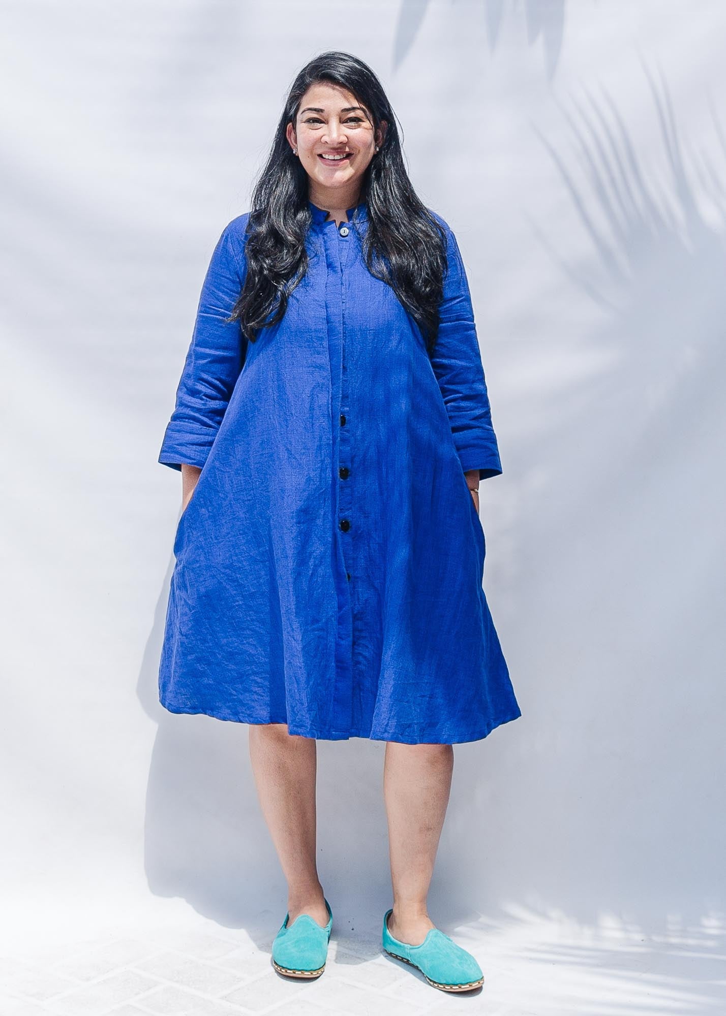 The model is wearing blue dress