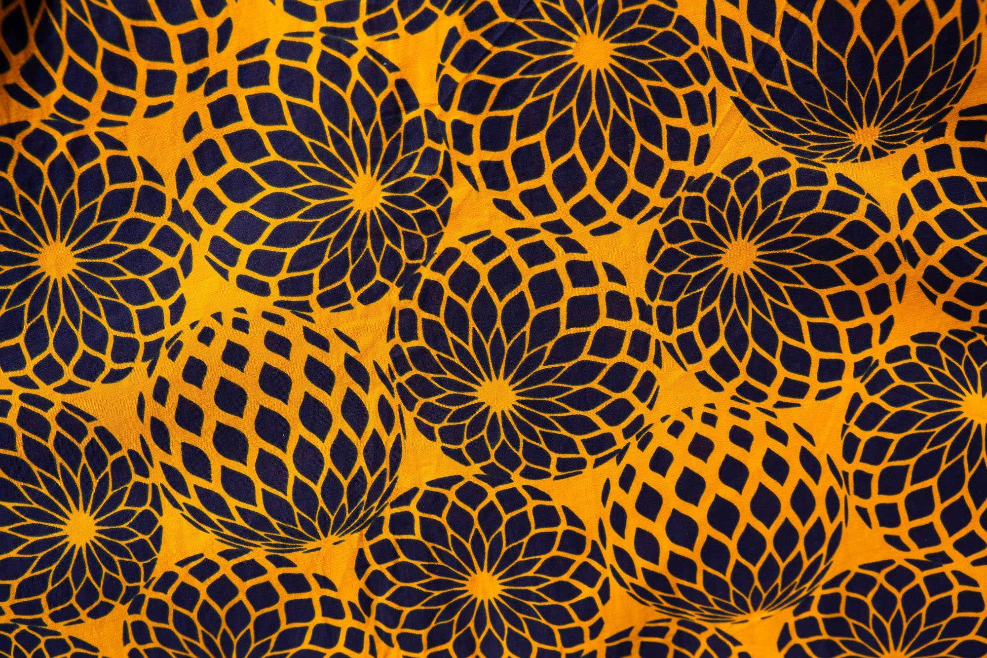 Close up display of black, yellow print dress