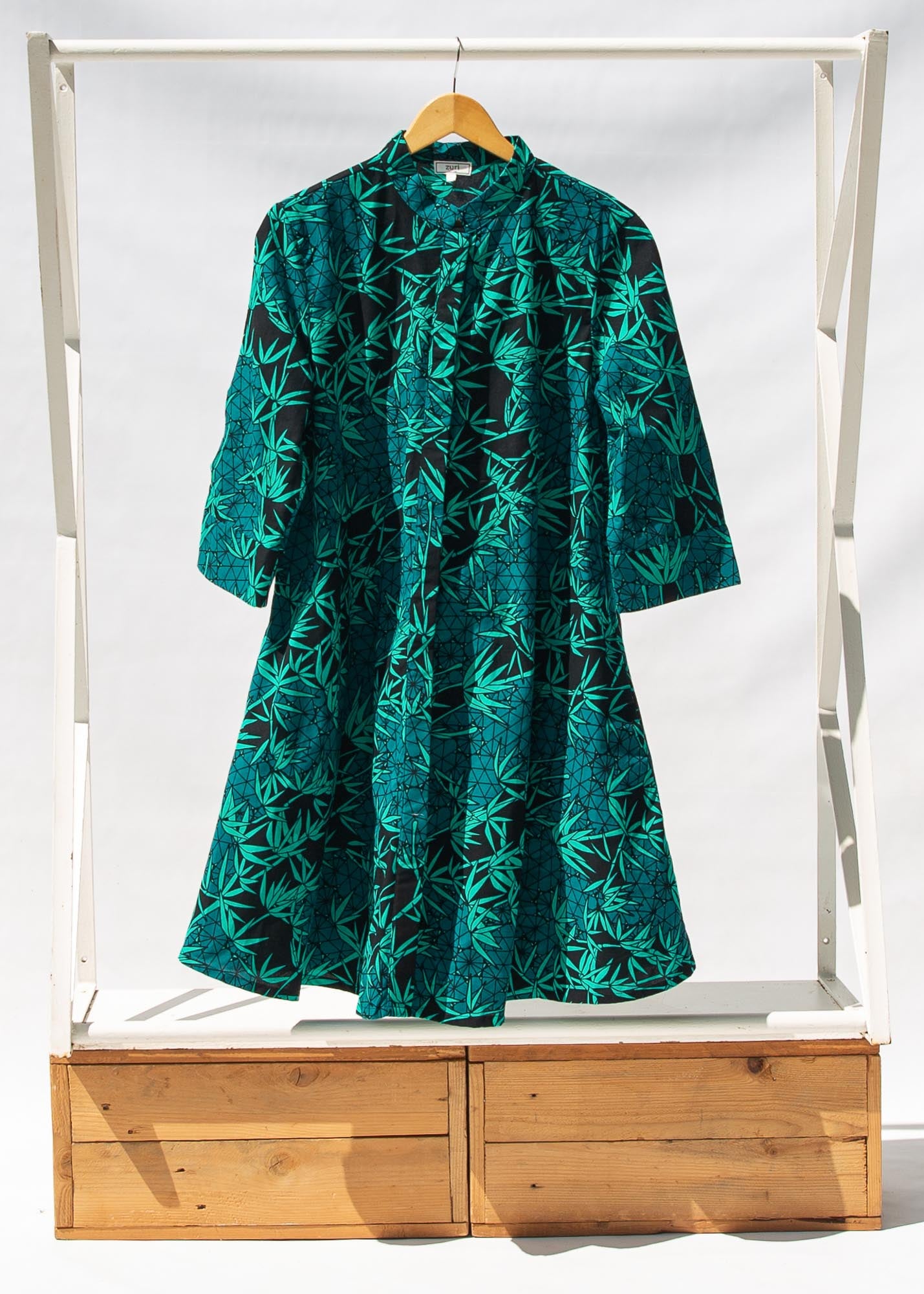 Display of  black, blue, green print dress