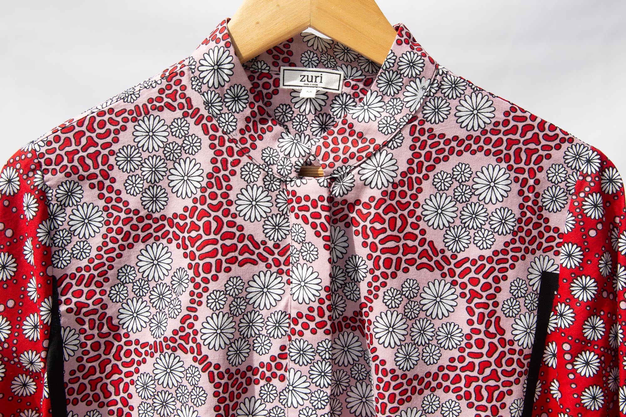 Display of red, black, white print shirt