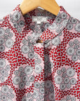 Display of red, black, white print shirt