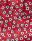 Close up display of red, black, white print shirt