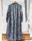 Display of sky blue, blue, orange print midi dress