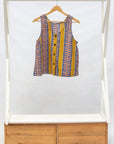 Display of olive-yellow, blue, orange and white geometric printed tank