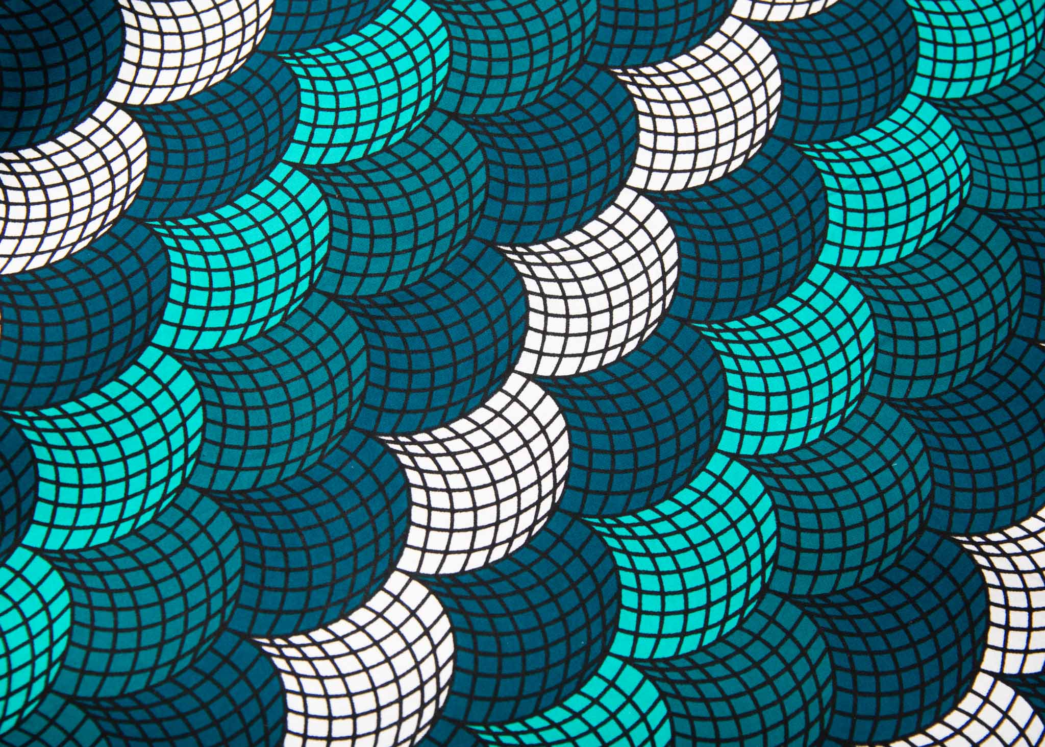 Display of circular grid print dress, with hues of blue, fabric.