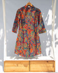 Display of multicolored feather print dress.