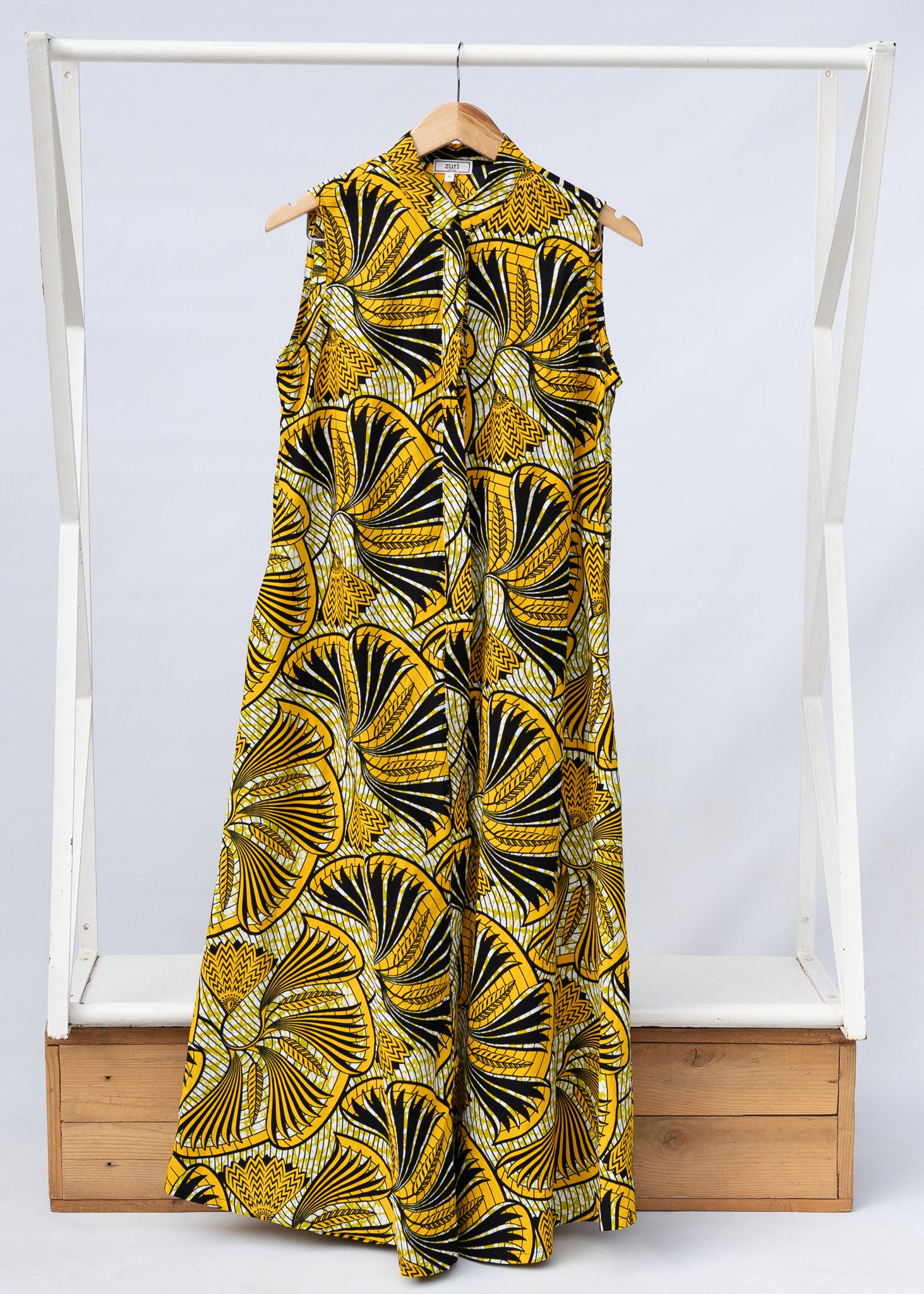 Display of yellow and black sleeveless maxi dress.