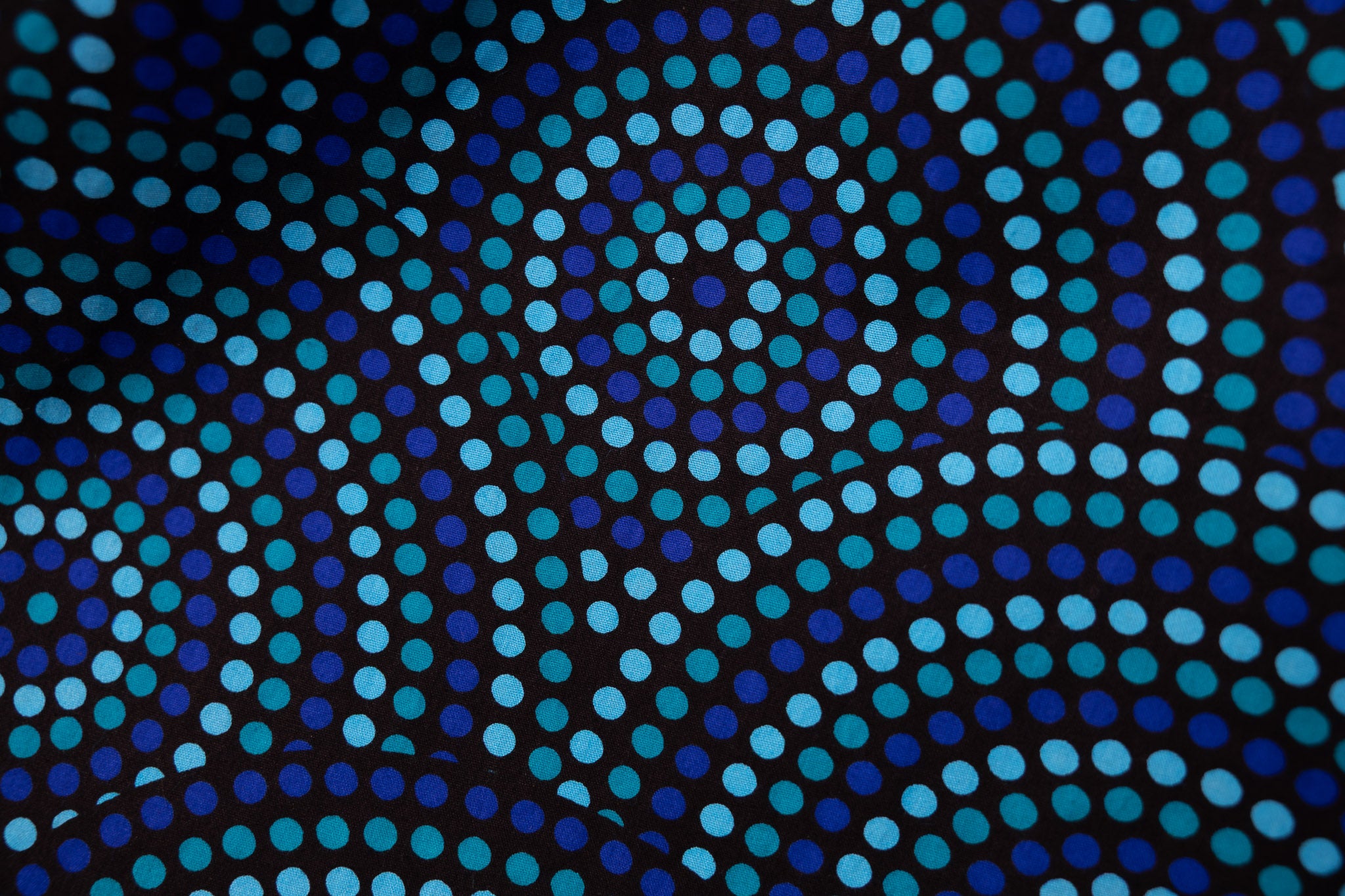 Close up display of blue pants dotted pattern.