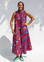 Model wearing a red and blue graphic print sleeveless dress.