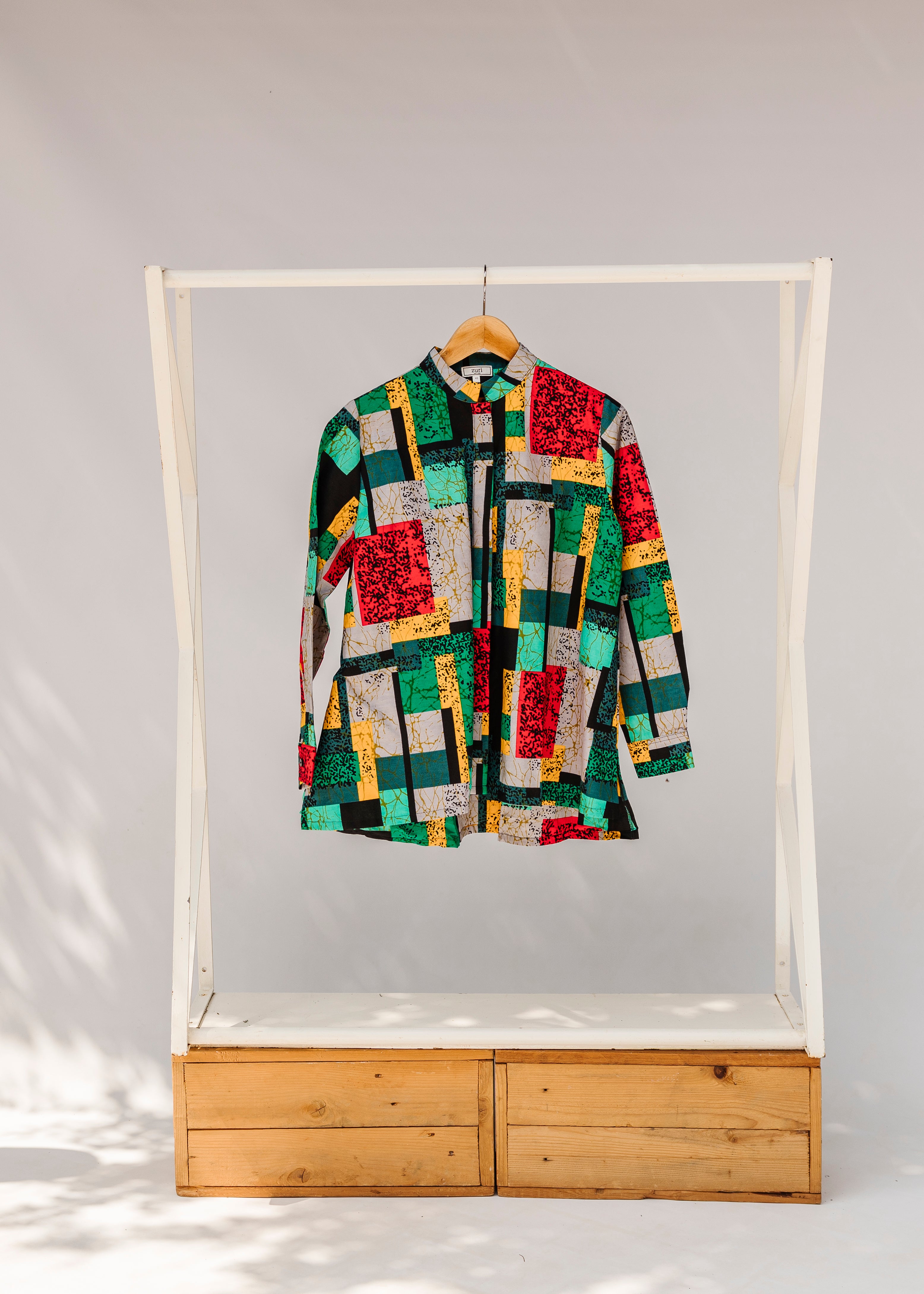 Display of mutlicolor abstract print shirt.