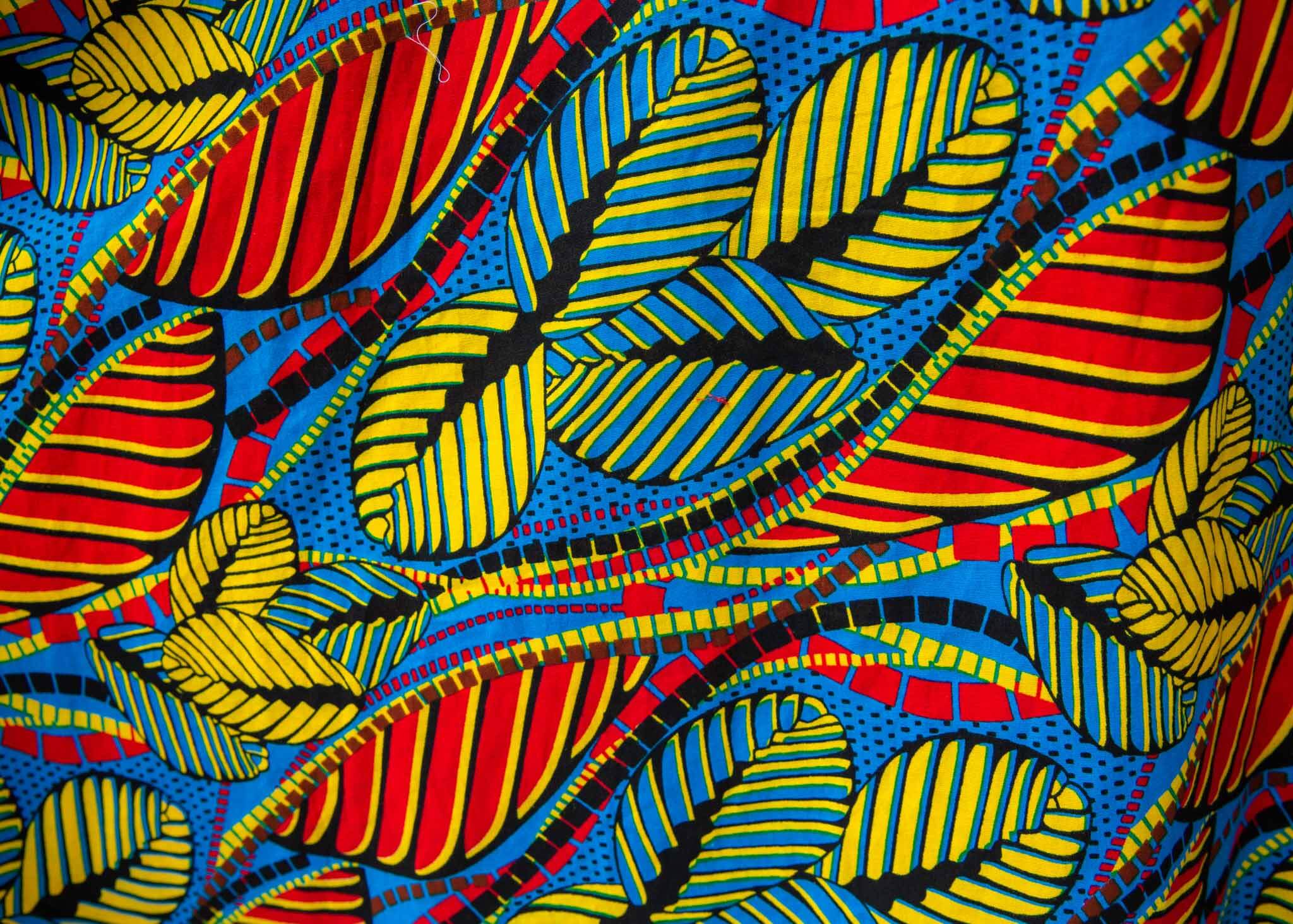 Detail of a colorful rainbow leaves print dress.