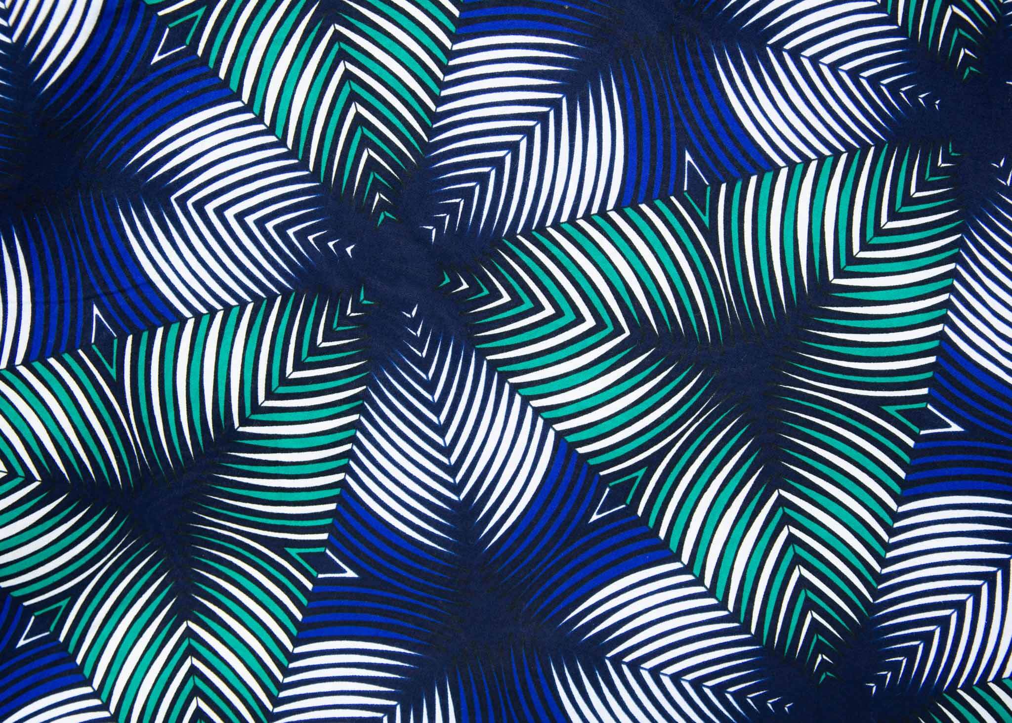 Display of blue, white, and green, geometric print dress.