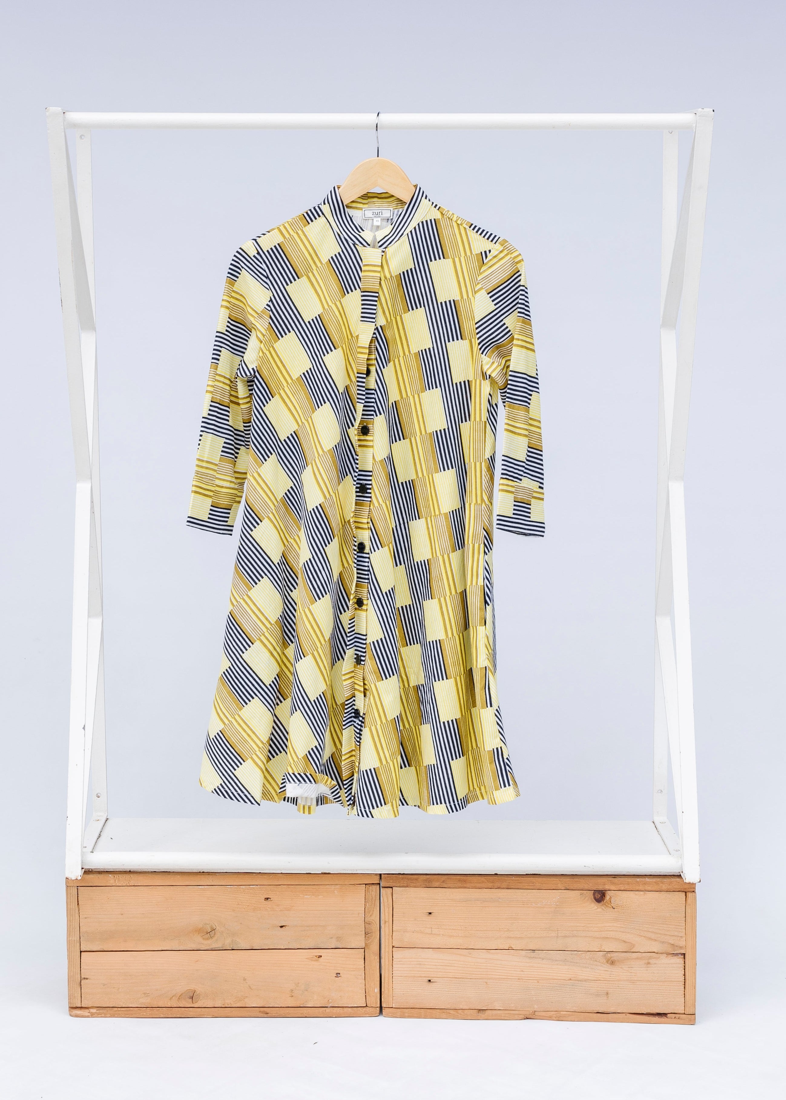 Display of yellow and black striped dress.