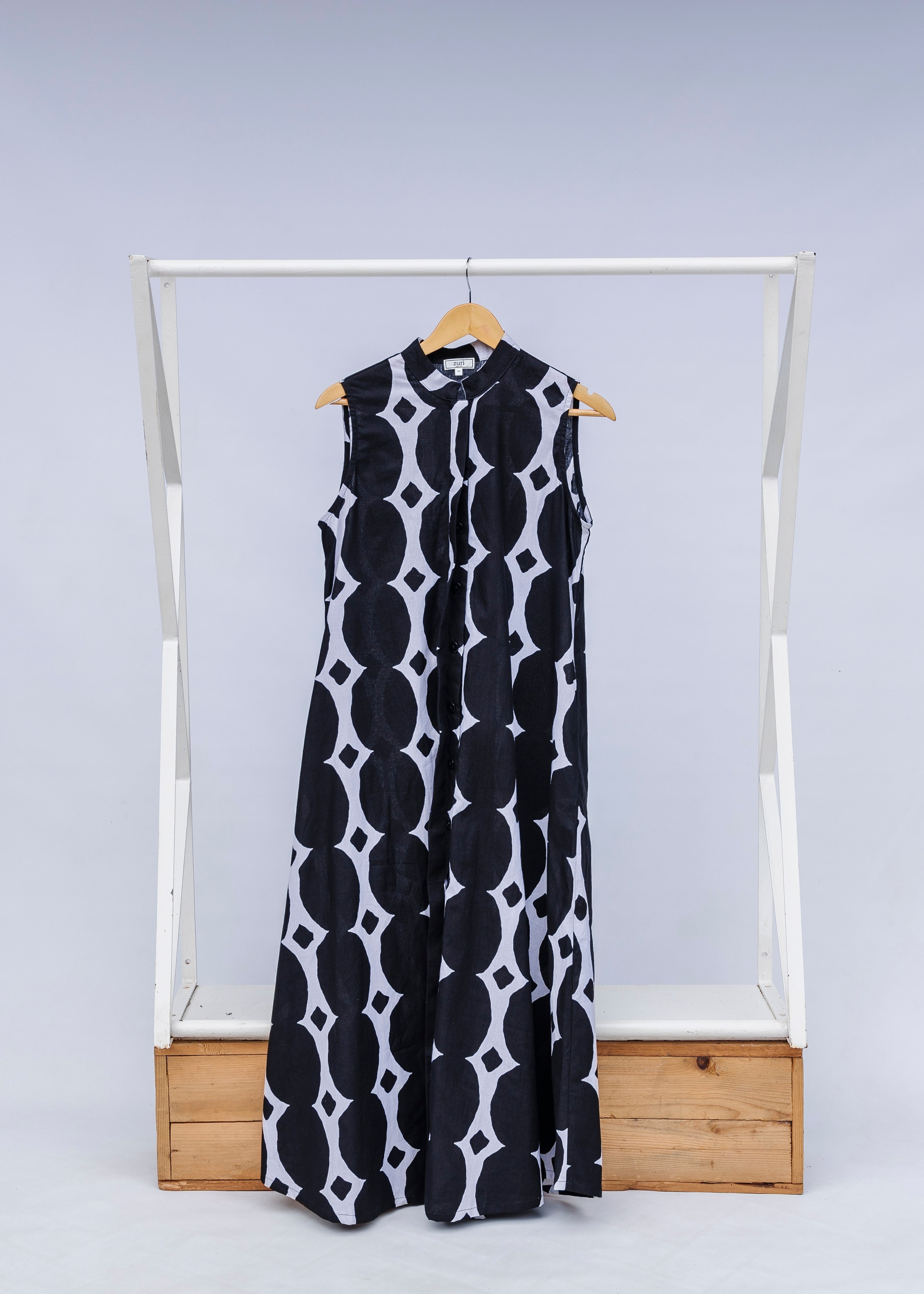 Display of black and white geometric print dress.
