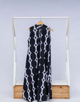 Display of black and white geometric print dress.