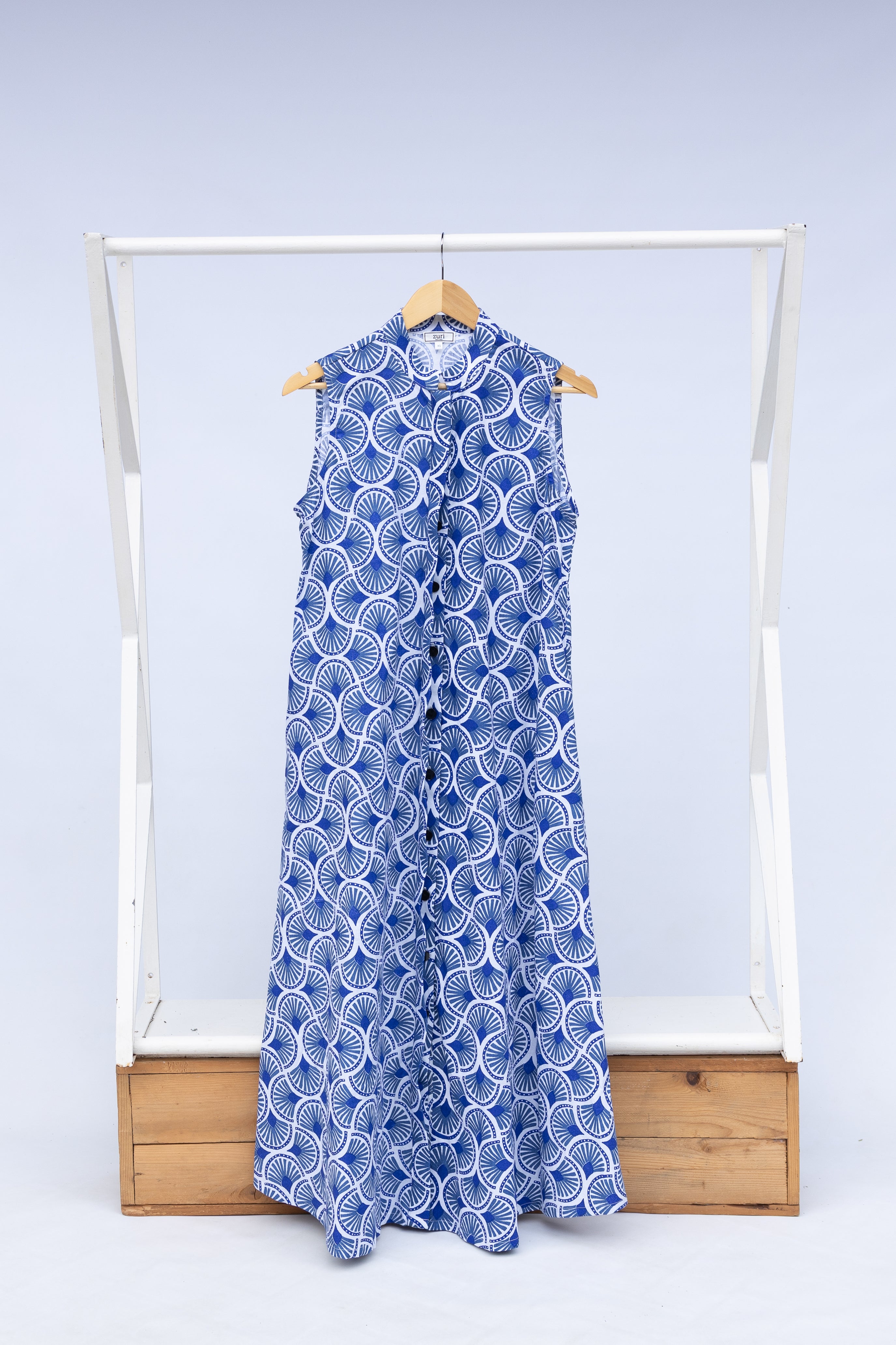 Display of blue and white mosaic print dress.