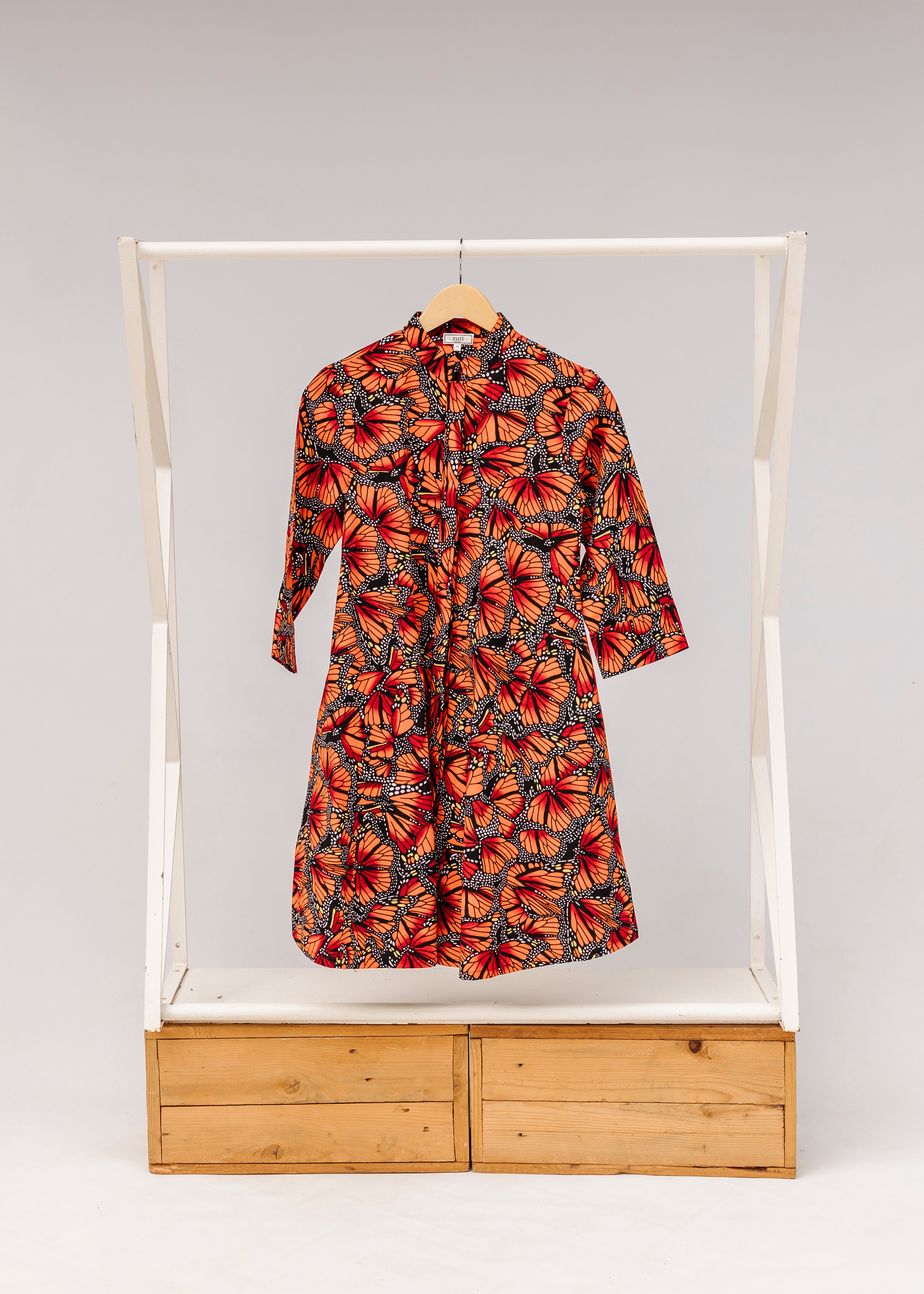 Display of butterfly print dress.