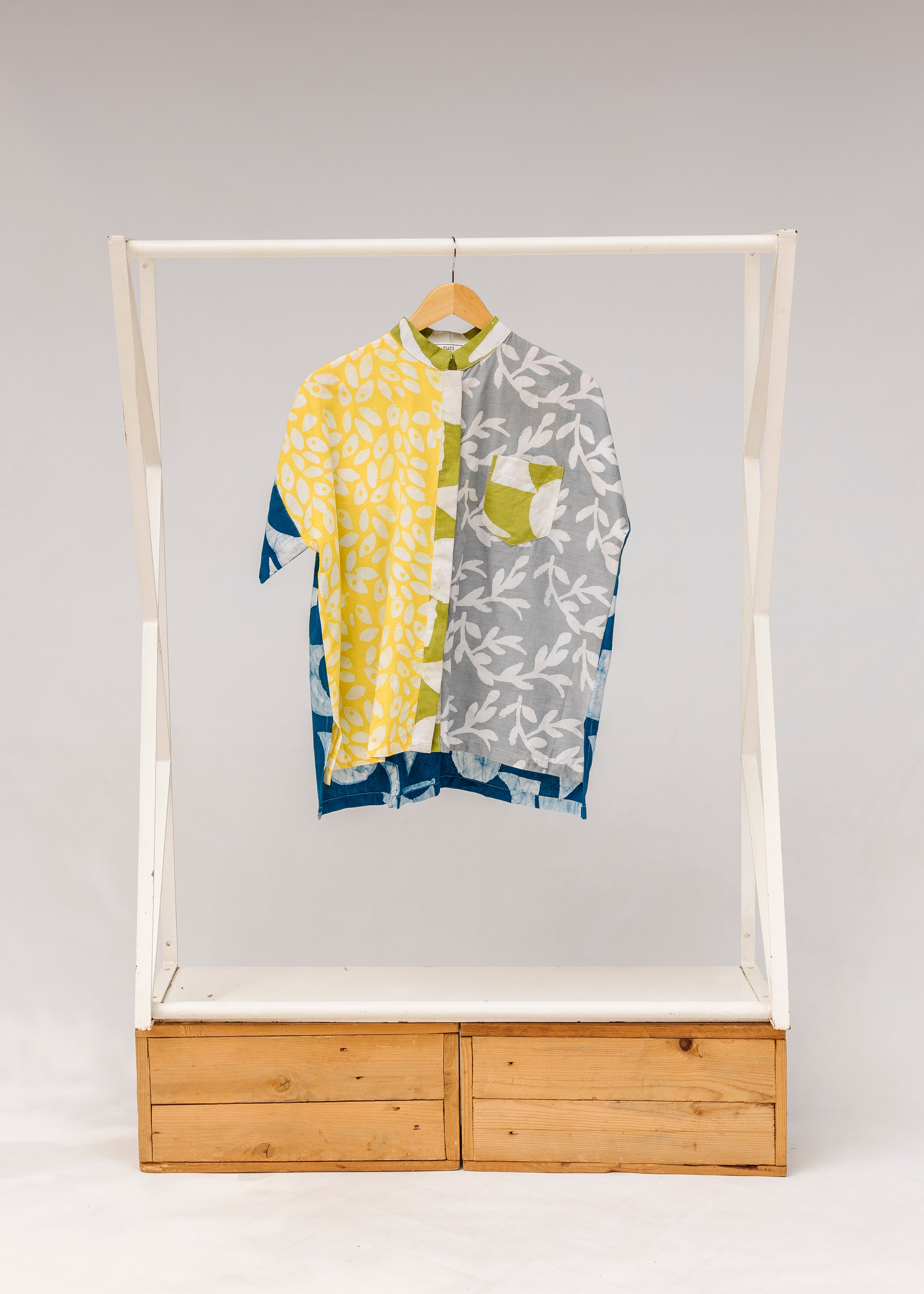 Display of mutlicolored batik shortsleeved shirt.