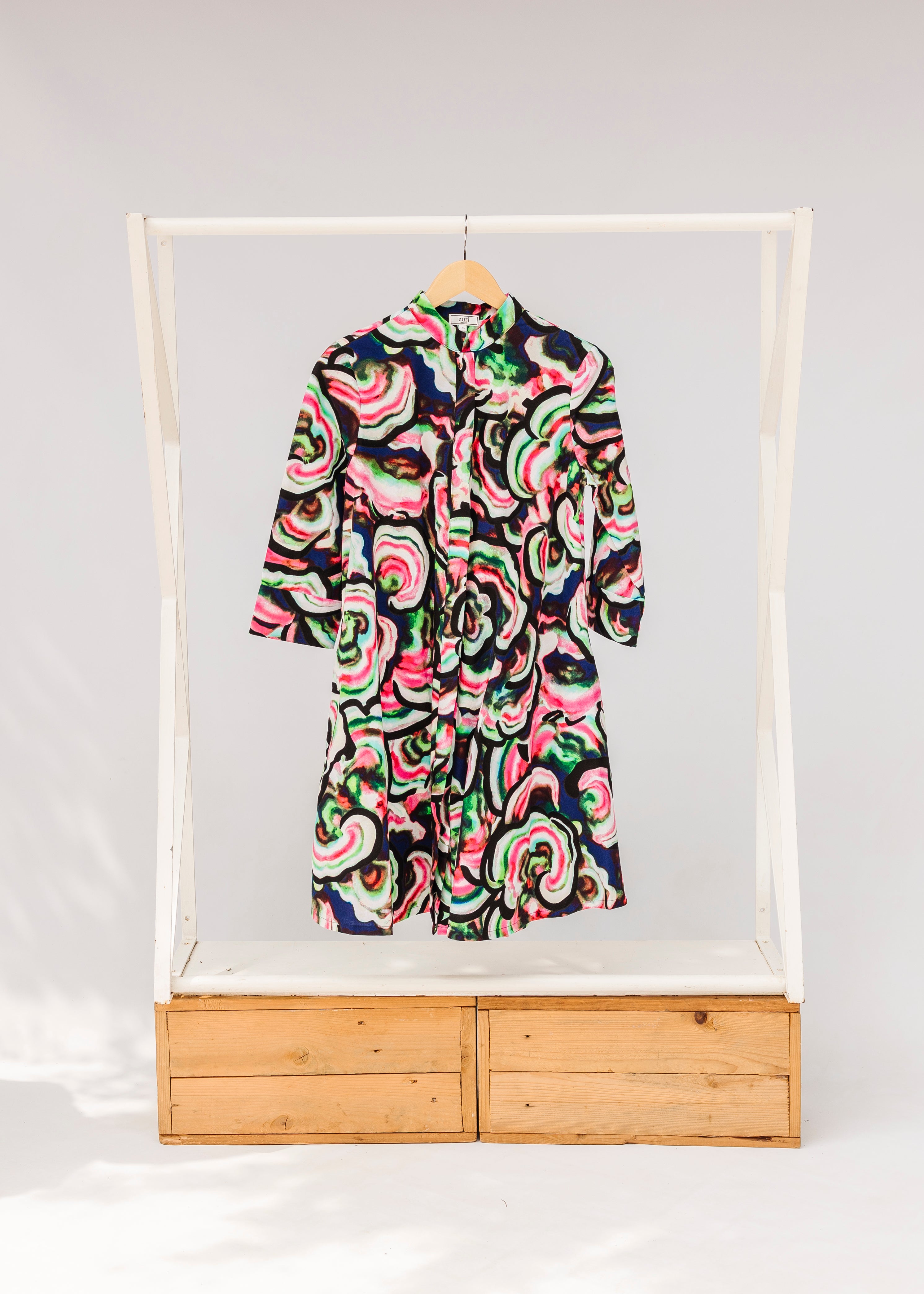 Display of colorful abstract print dress.