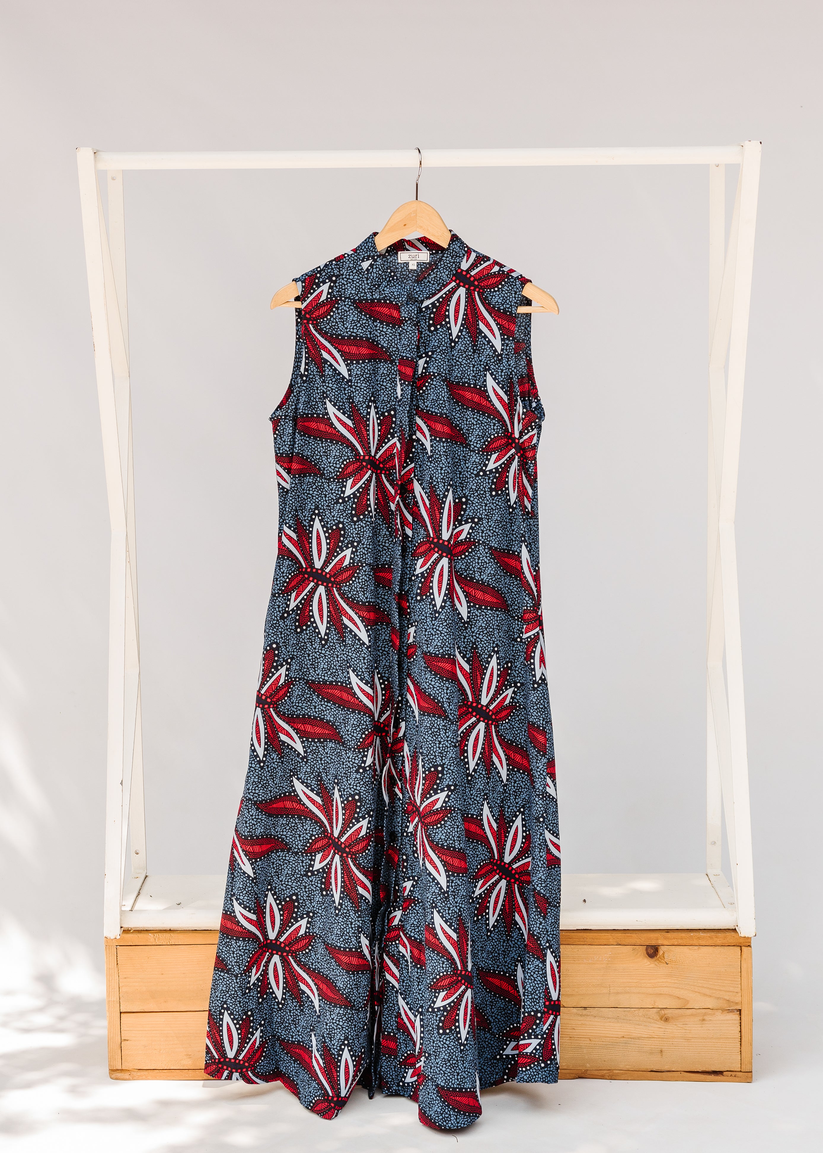 Display of grey, red and black dragonfly print dress.