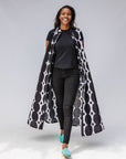 Model wearing black and white geometric print dress.