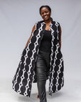 Model wearing black and white geometric print dress.