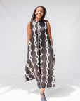 Model wearing black and white geometric print dress.