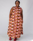 Model wearing geometric print dress.