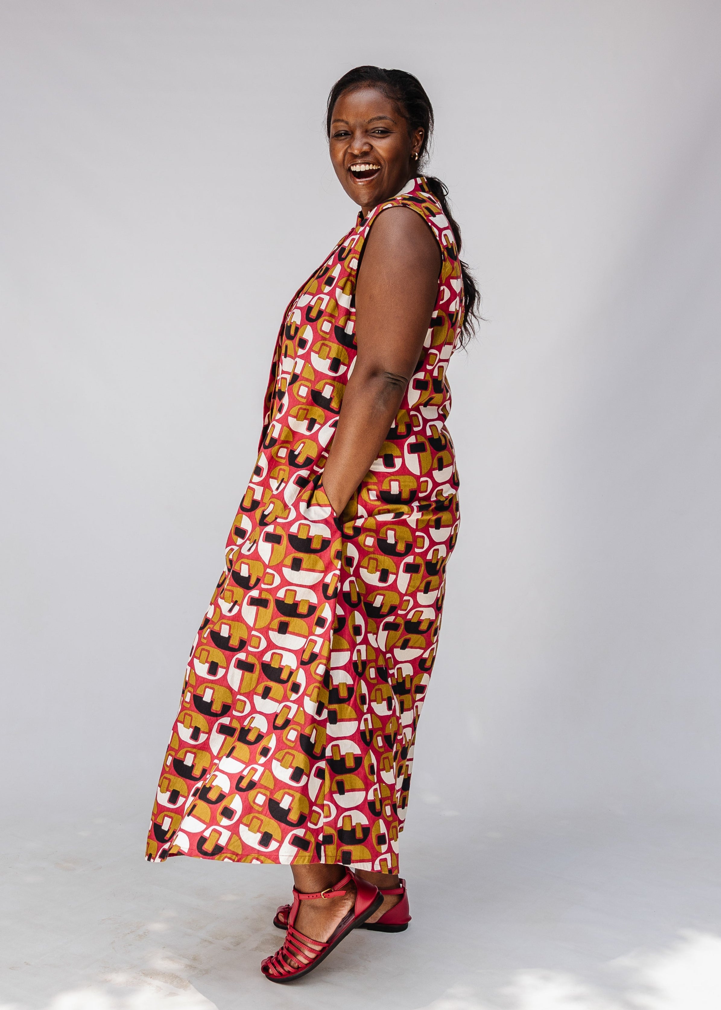 Model wearing geometric print dress.