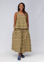Model wearing mustard and black triangle print pants and tank.