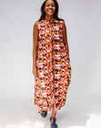 Model wearing geometric print dress.