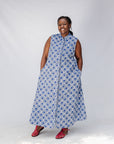 Model wearing blue and white mosaic print dress.