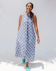 Model wearing blue and white mosaic print dress.