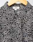 Display of black and white doodle print dress