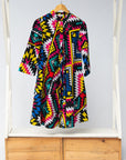 Display of multi colored geometric print dress