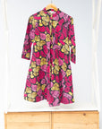 Display of black, white, yellow, brown, pink, hot pink and purple bubble print dress