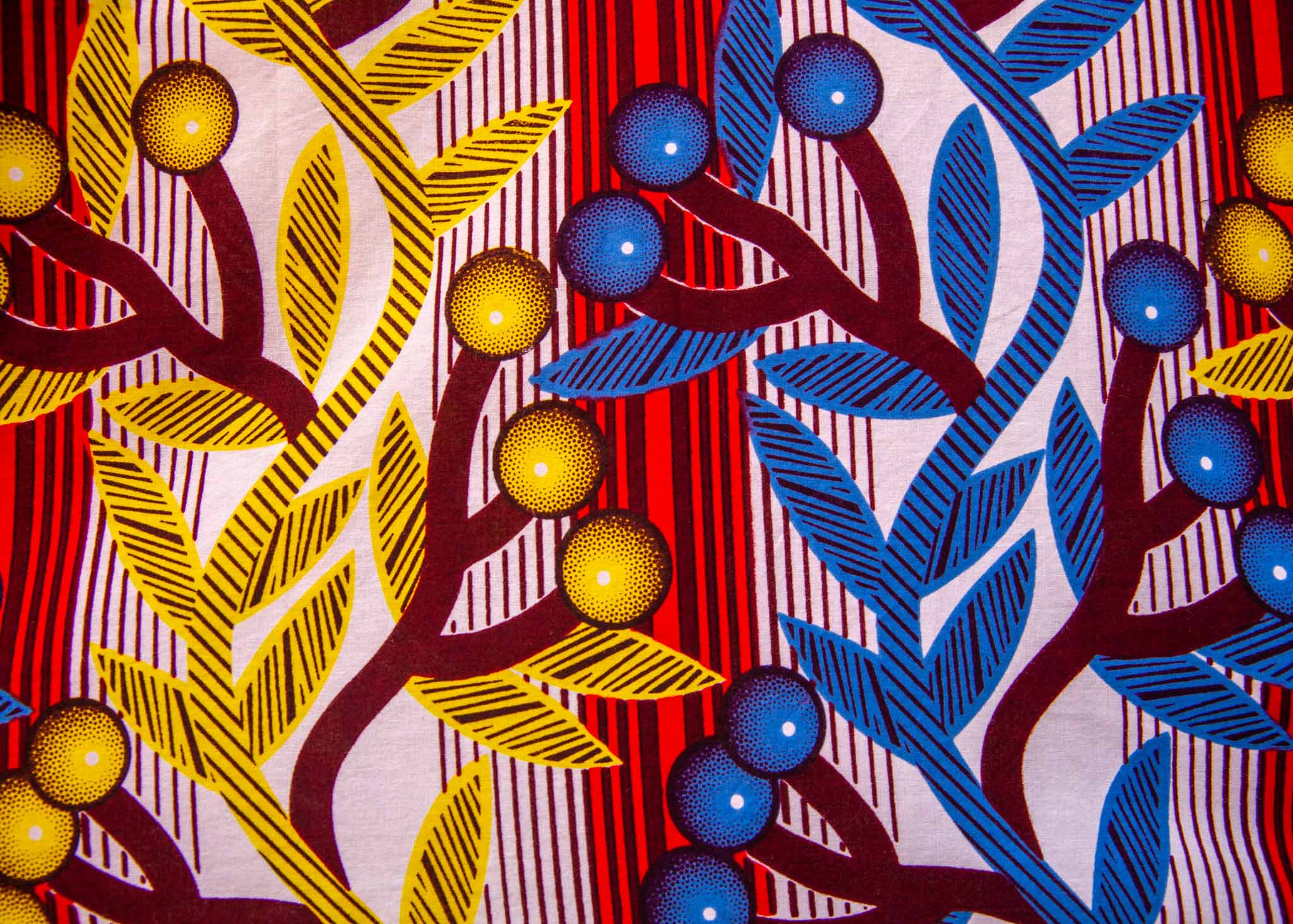 Close up display of rainbow vine print dress, fabric.