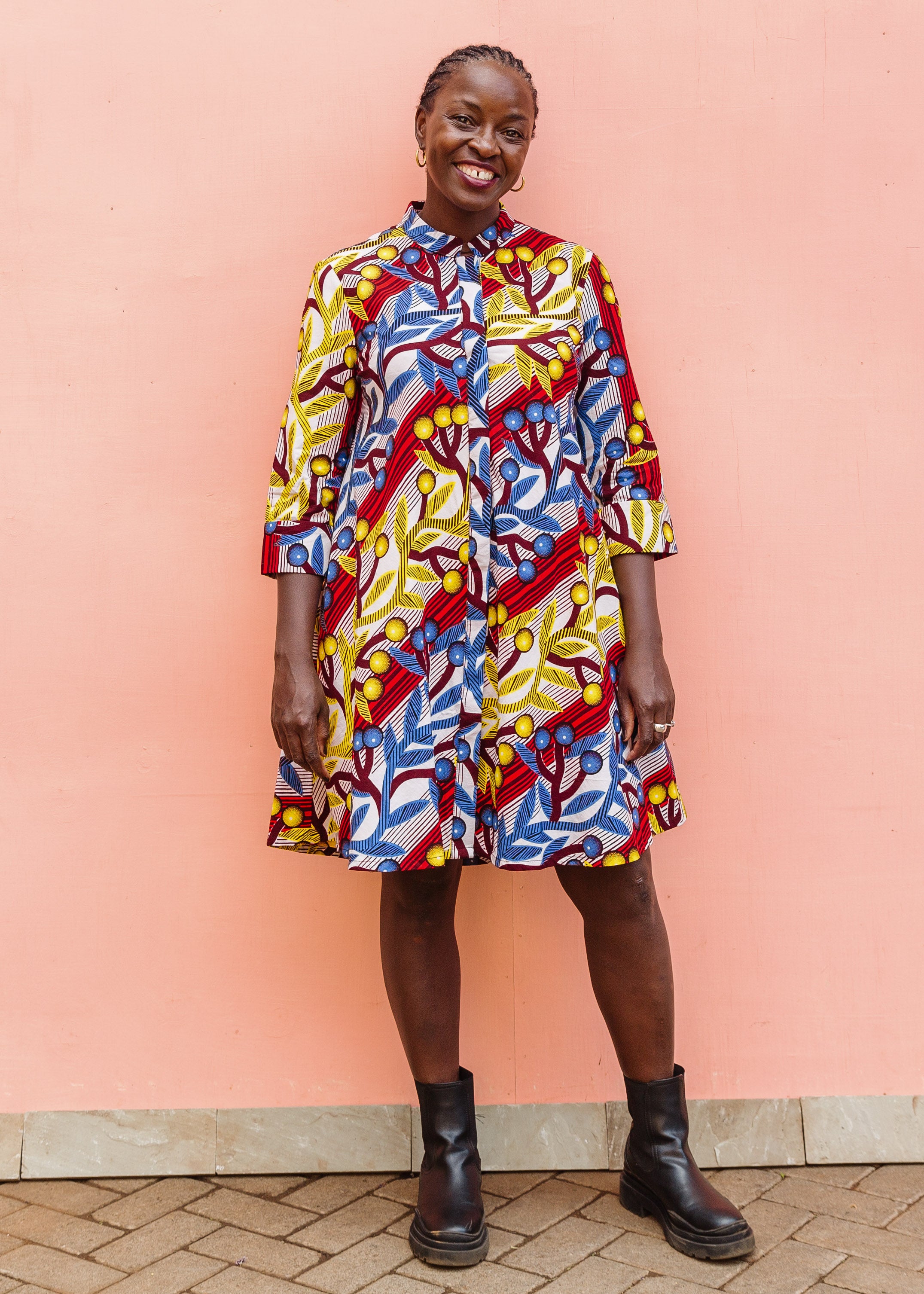 Model wearing rainbow vine print dress.