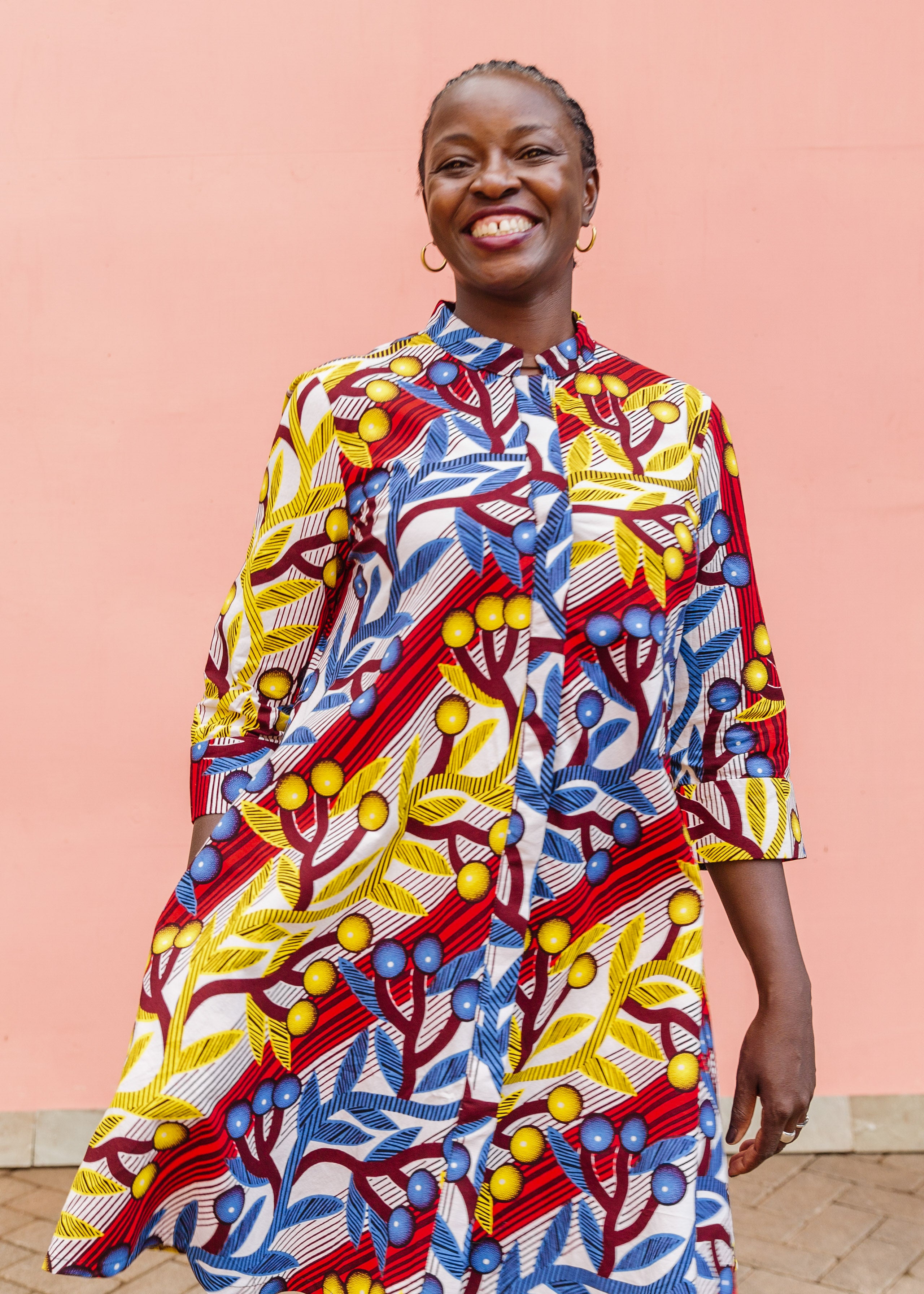 Model wearing rainbow vine print dress.