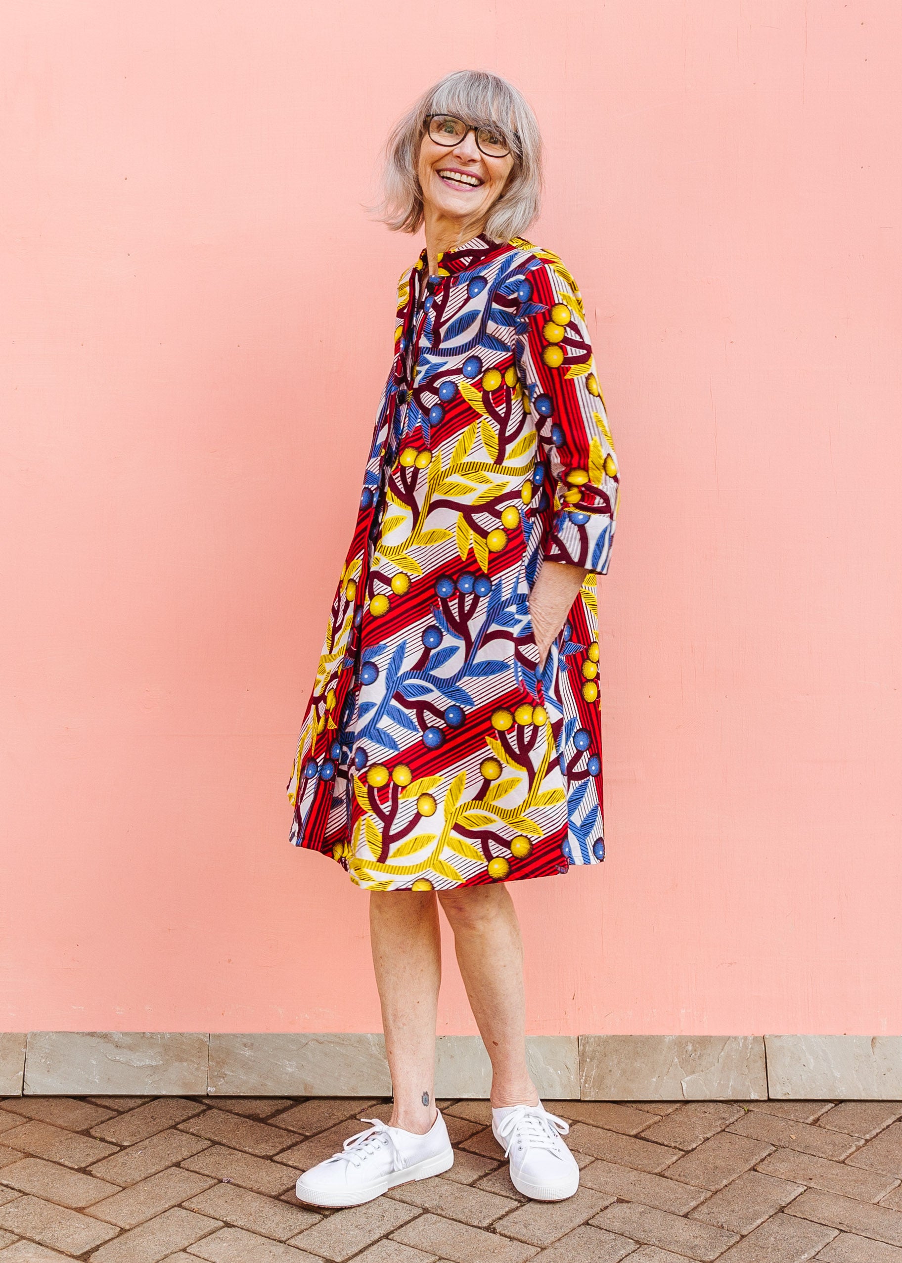 Model wearing rainbow vine print dress.