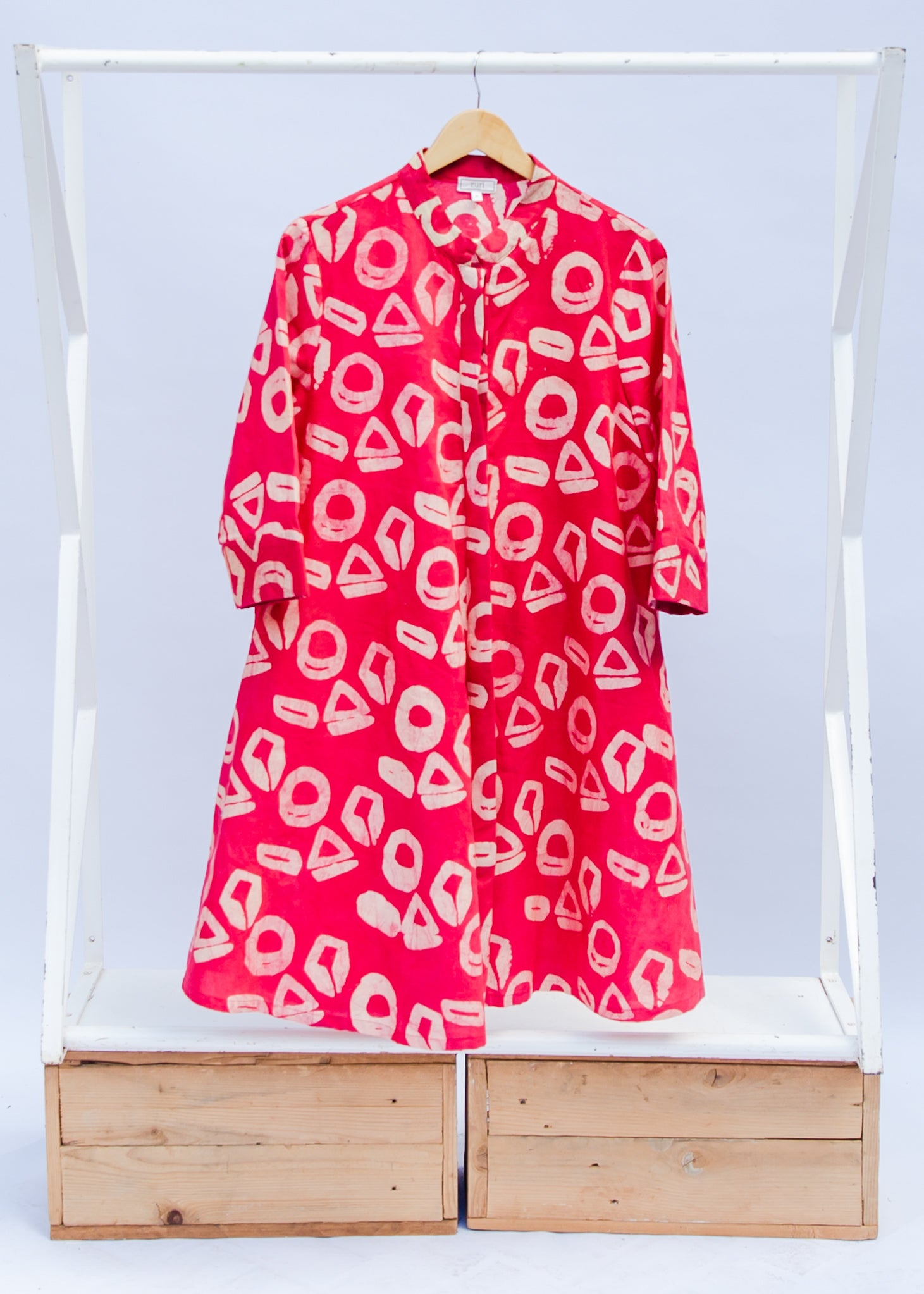 display of a pink and white geometric print dress