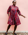 model wearing a red ladder design dress